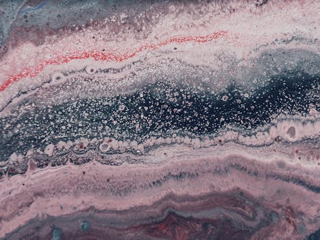 迷人的抽象漩涡图案，色彩充满活力、流畅，并具有丰富的油漆纹理