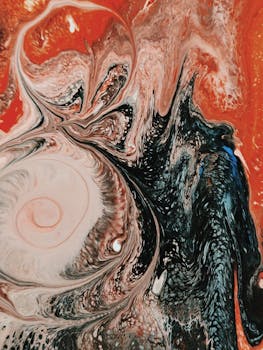 色彩缤纷的抽象流体艺术，呈现出旋转的丙烯酸油漆图案