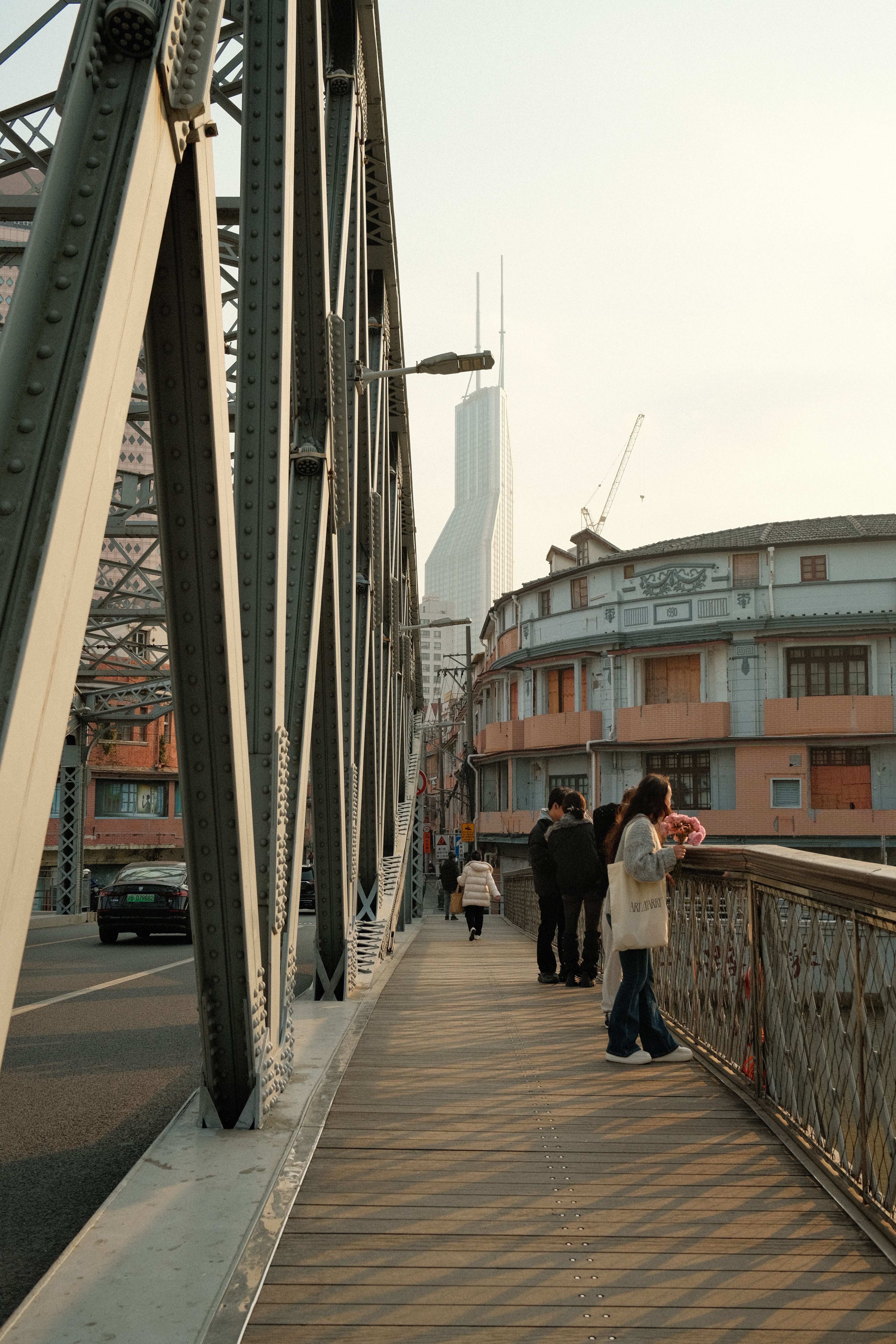 city street scene with bridge and skyscraper