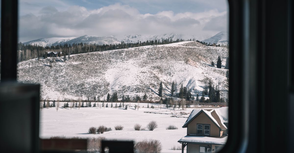 A picturesque snowy mountain landscape seen through a window in Colorado.