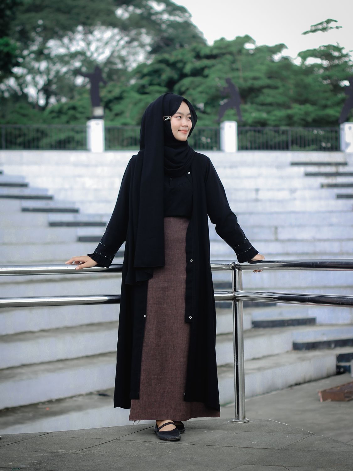 Young Woman in Modest Fashion Outdoors · Free Stock Photo