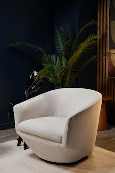 Chic and moody podcast studio setup in Montreal with elegant white accent chair.