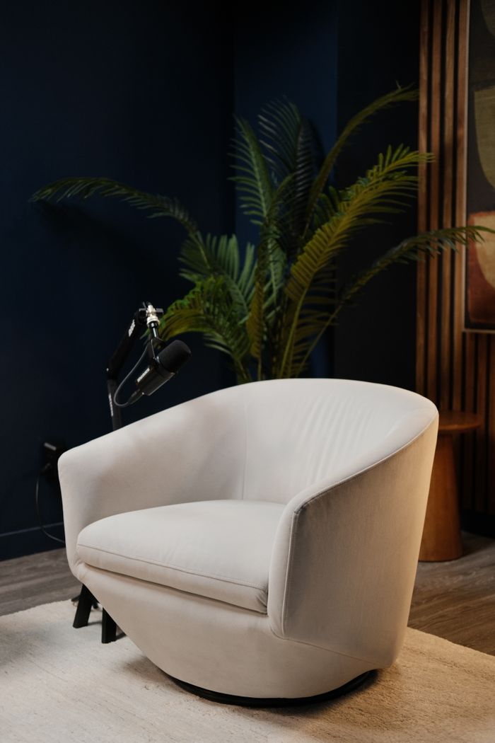 Modern podcast studio interior with accent chair