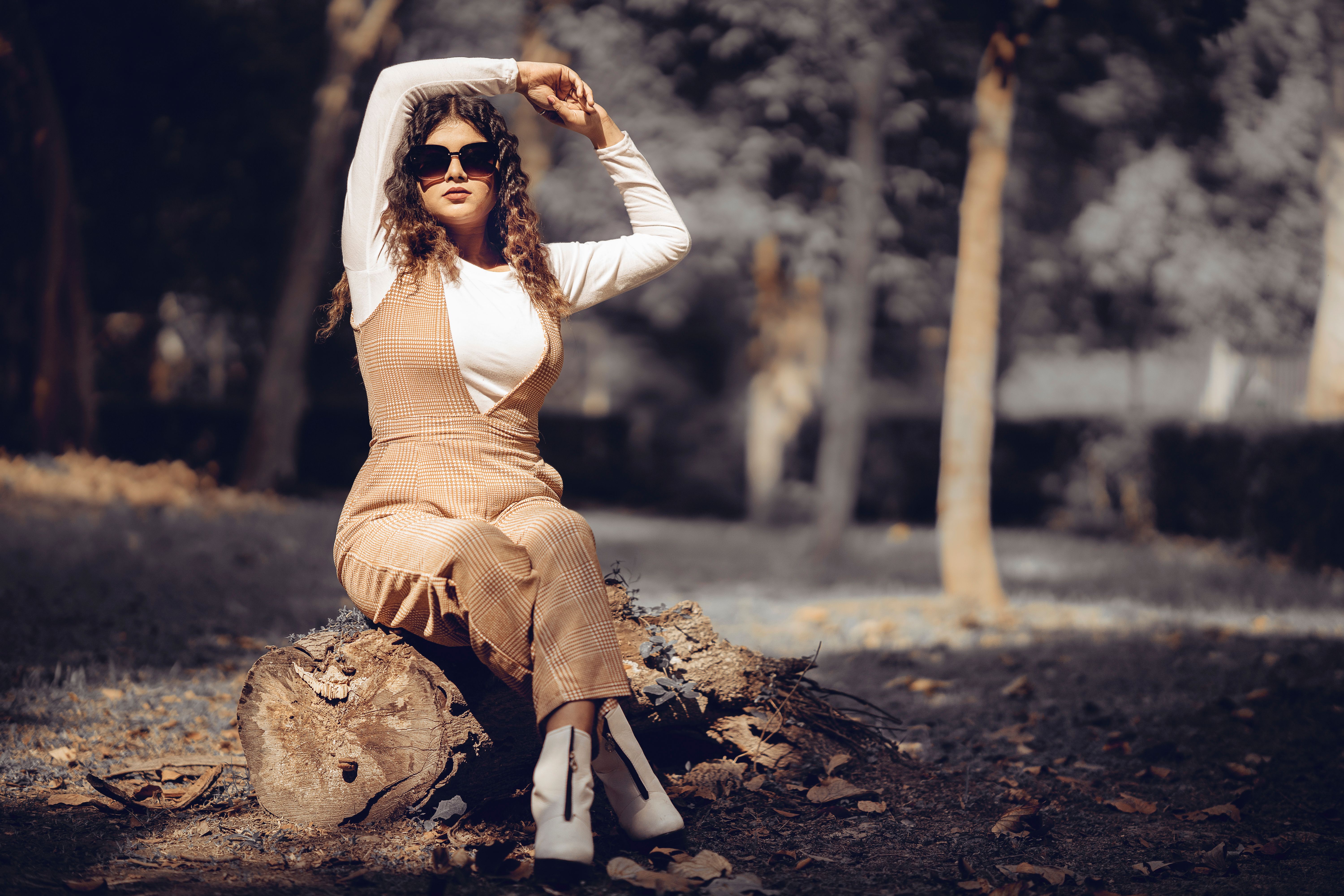Stylish Woman Posing Outdoors in Sunglasses · Free Stock Photo
