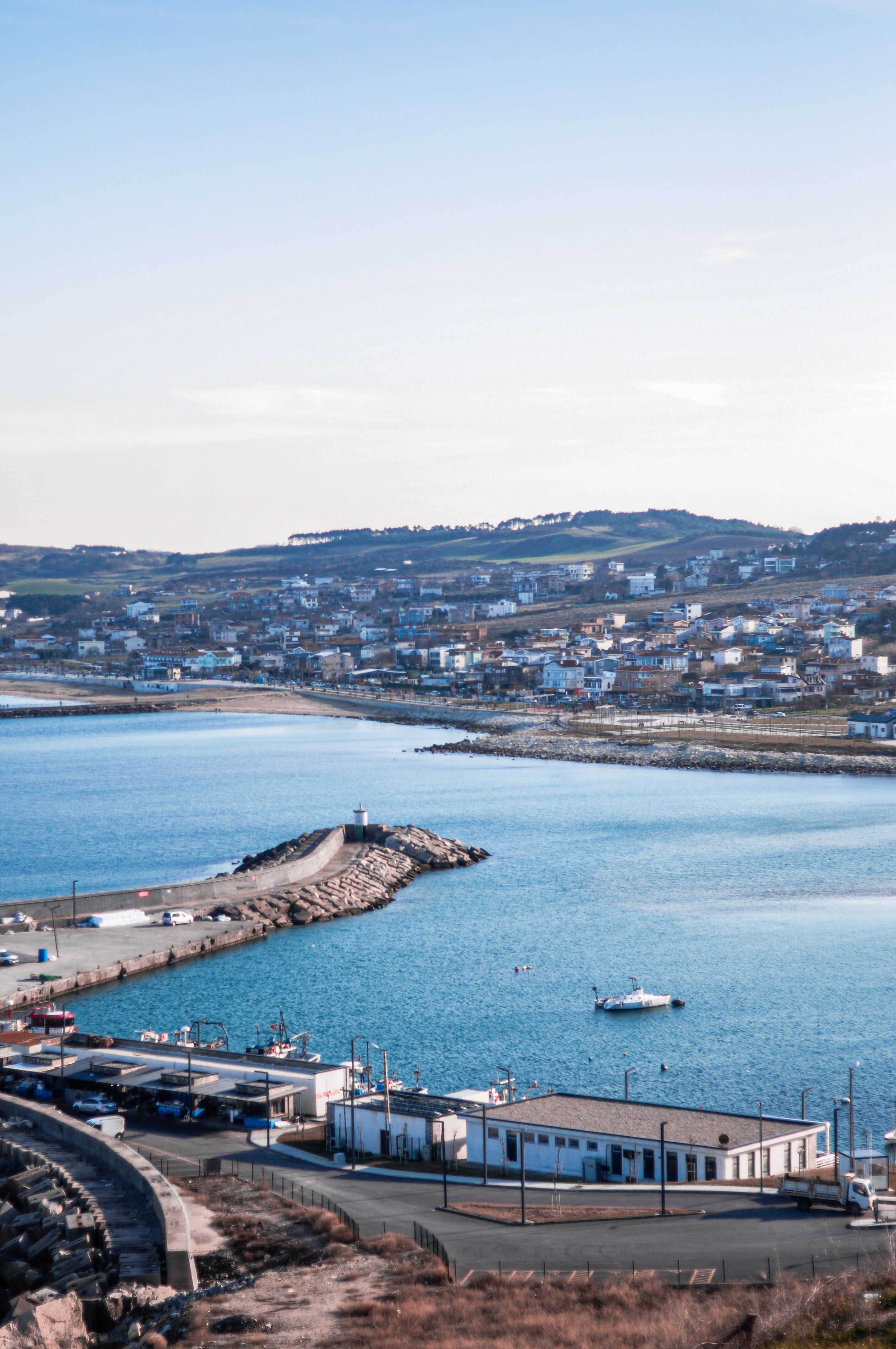 Coastal Town View with Harbor and Blue Sea · Free Stock Photo