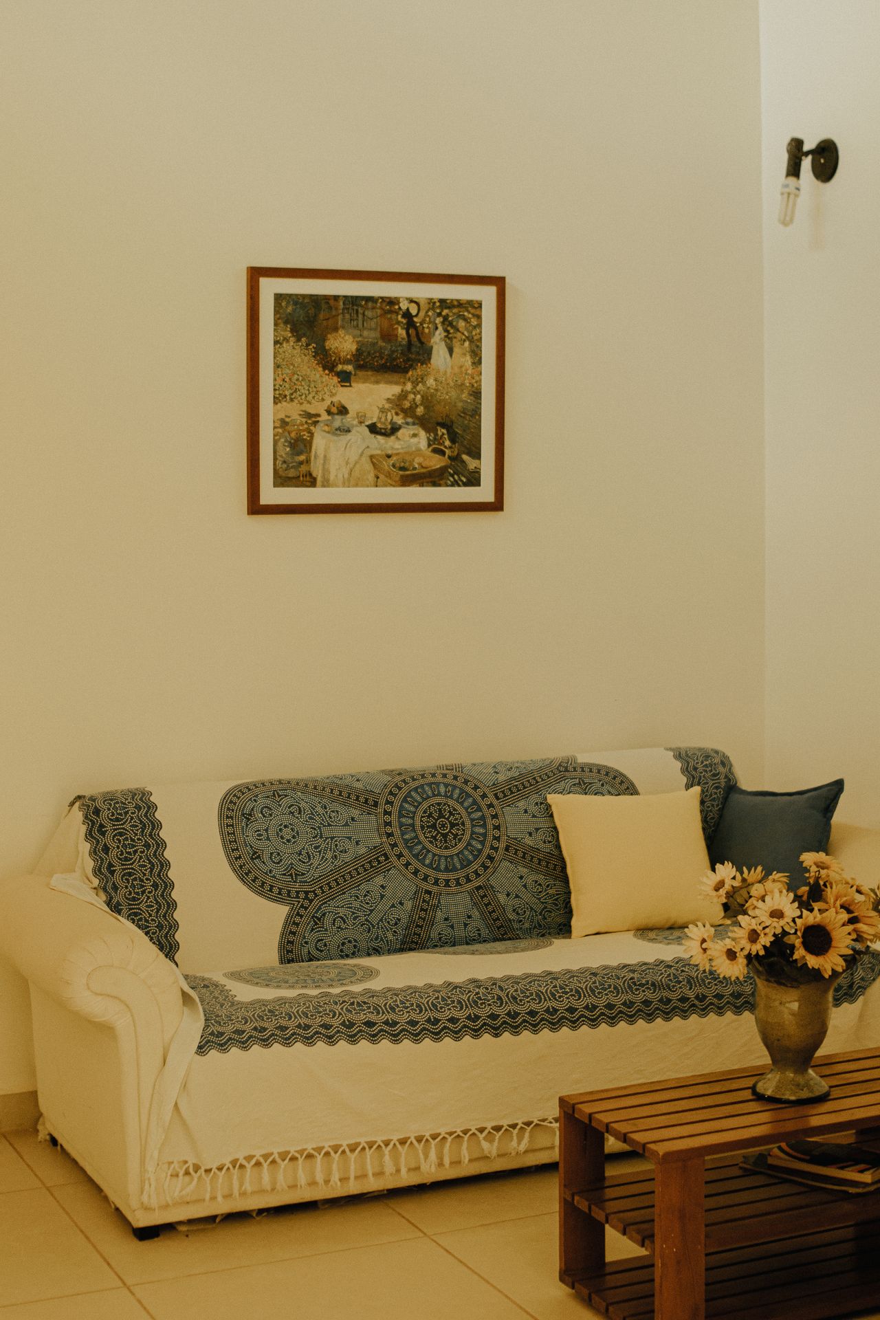 Living room with framed artwork on the wall above a sofa