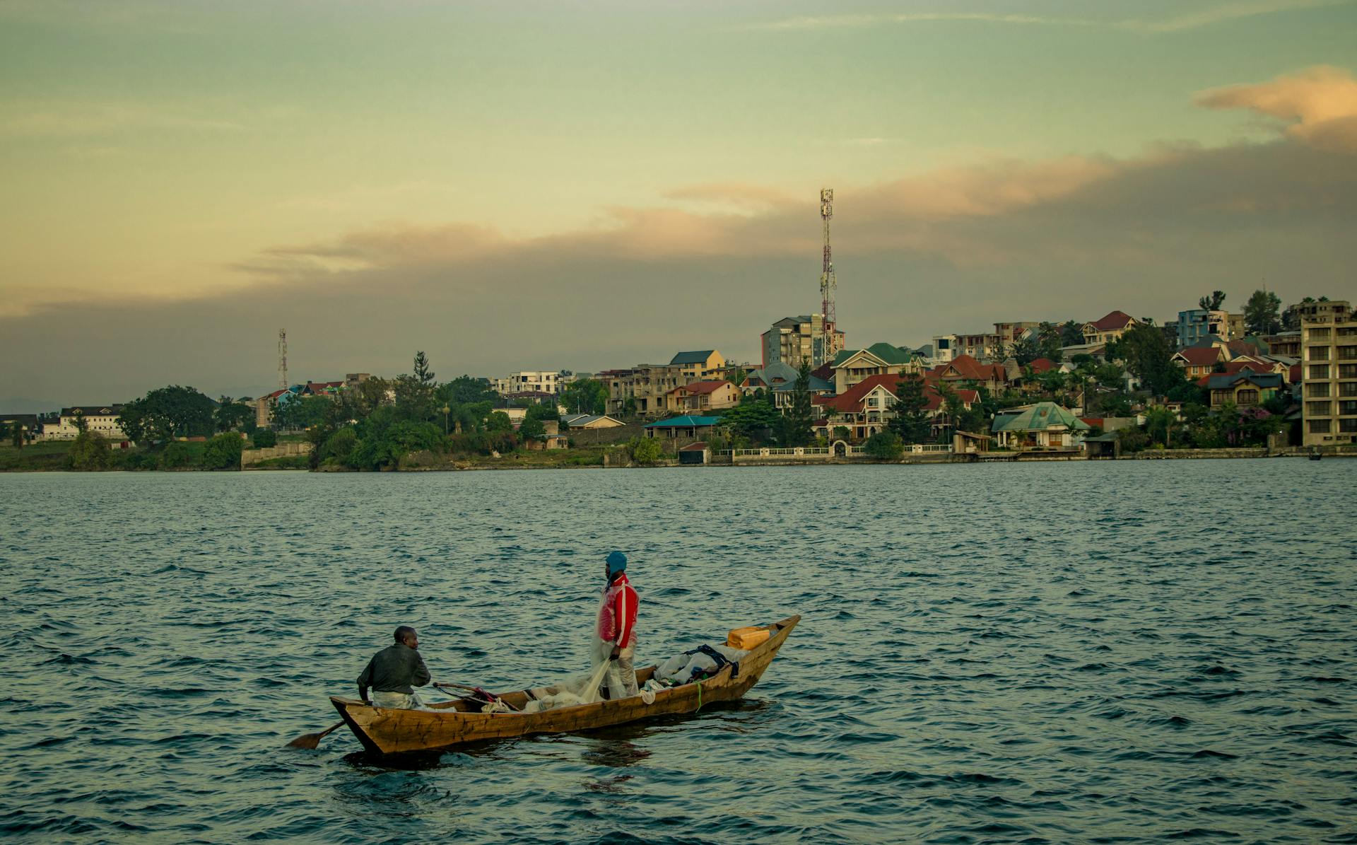 Fishermen on Lake Kivu in Goma, Democratic Republic of Congo during sunset.