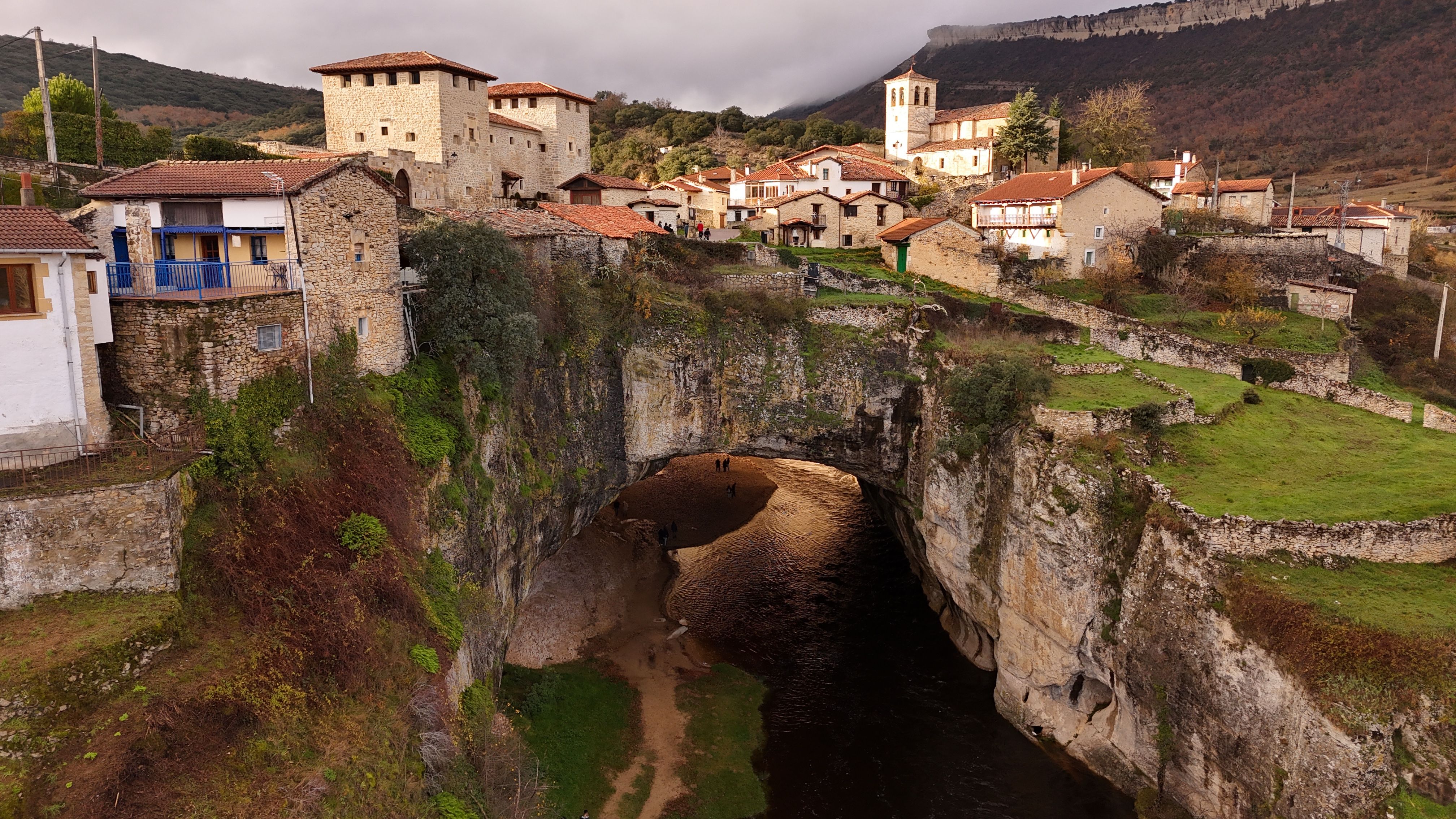 Stunning aerial view of historic Puentedey in Spain with natural rock bridge and charming village. - Burgos