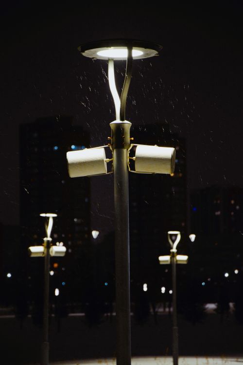 Free Elegant street lamps lighting up a snowy night in Astana, Kazakhstan, creating a serene urban scene. Stock Photo