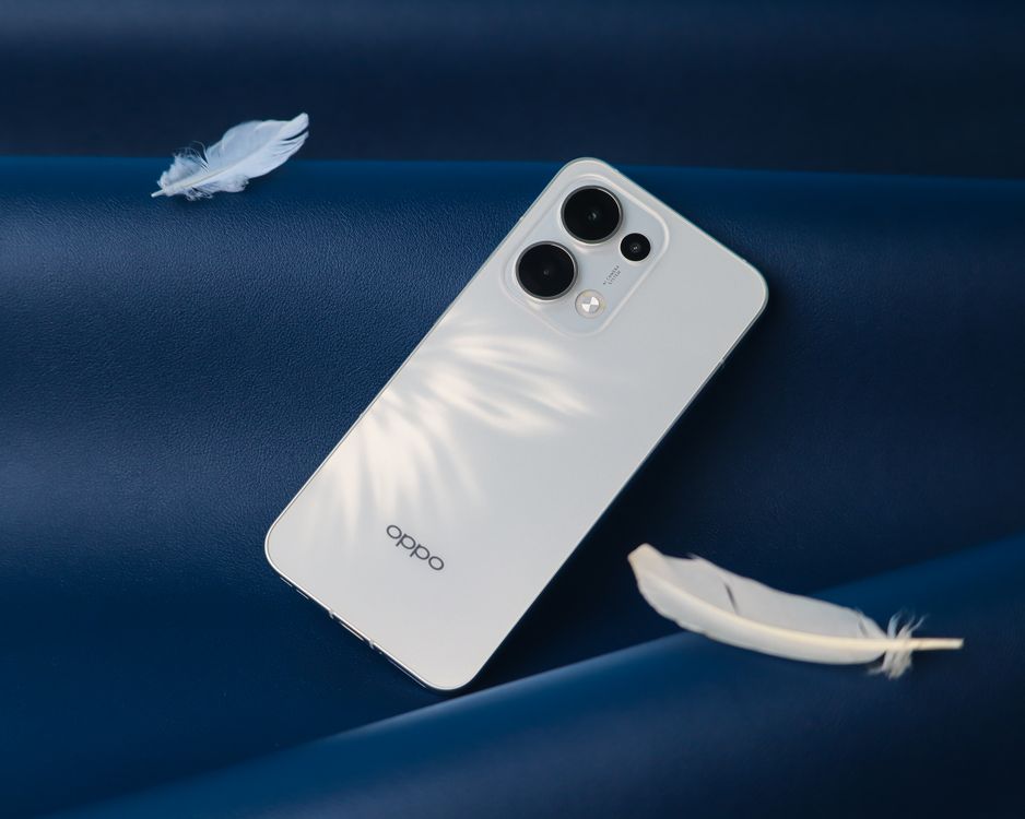 White Android Sleek White Smartphone on Blue Surface · Free Stock Photo