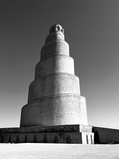 Free A black and white photo of the iconic spiral minaret of the Great Mosque in Samarra, Iraq. Stock Photo