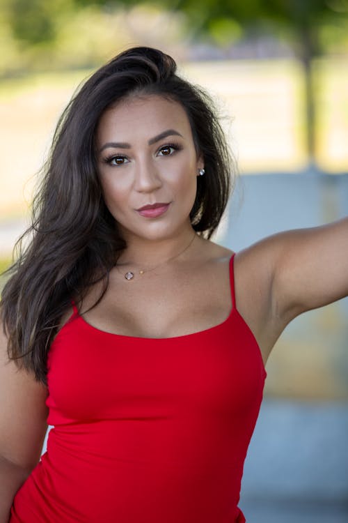 Selective Focus Photography Of Woman Wearing Red Camisole