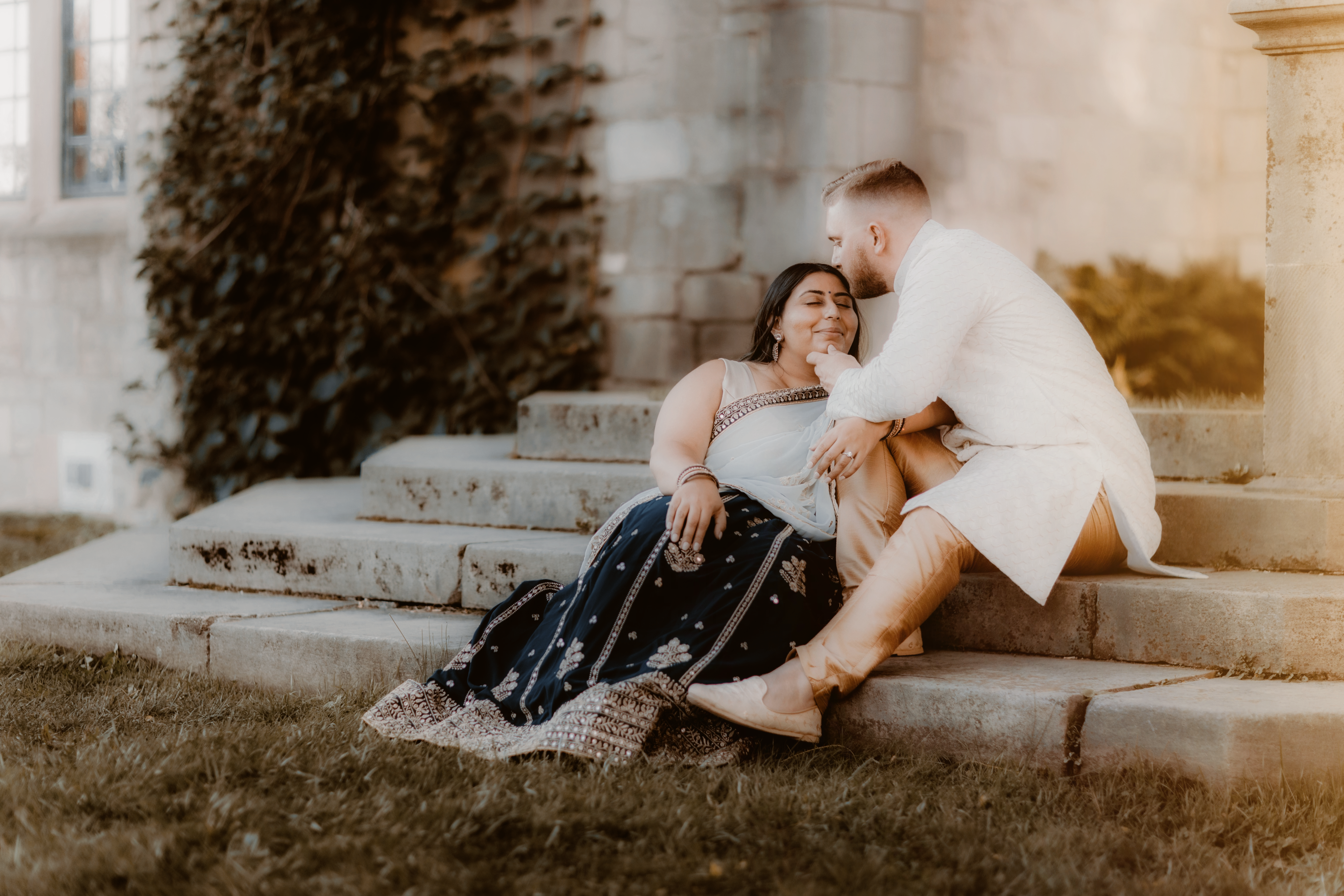 Romantic Couple Sitting Outdoors on Stone Steps · Free Stock Photo