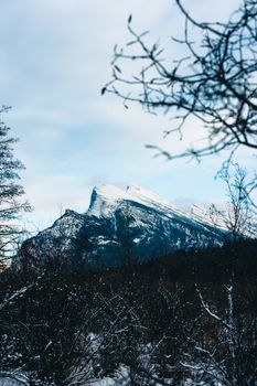 Snow-covered mountains with clear blue skies in Banff National Park, Alberta, Canada.