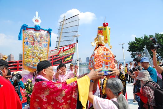 Vibrant cultural festival scene with traditional attire and colorful decorations.