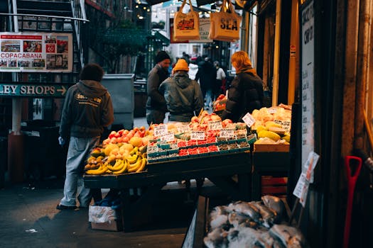 Vibrant street market in Seattle with fresh produce and people shopping.