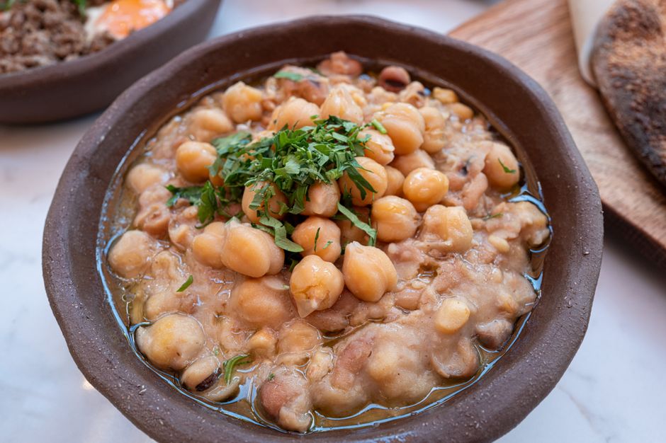 Vibrant Moroccan chickpea stew in a ceramic bowl with fresh cilantro - easy healthy chickpea recipes Vibrant Moroccan chickpea stew in a ceramic bowl with fresh cilantro - easy healthy chickpea recipes