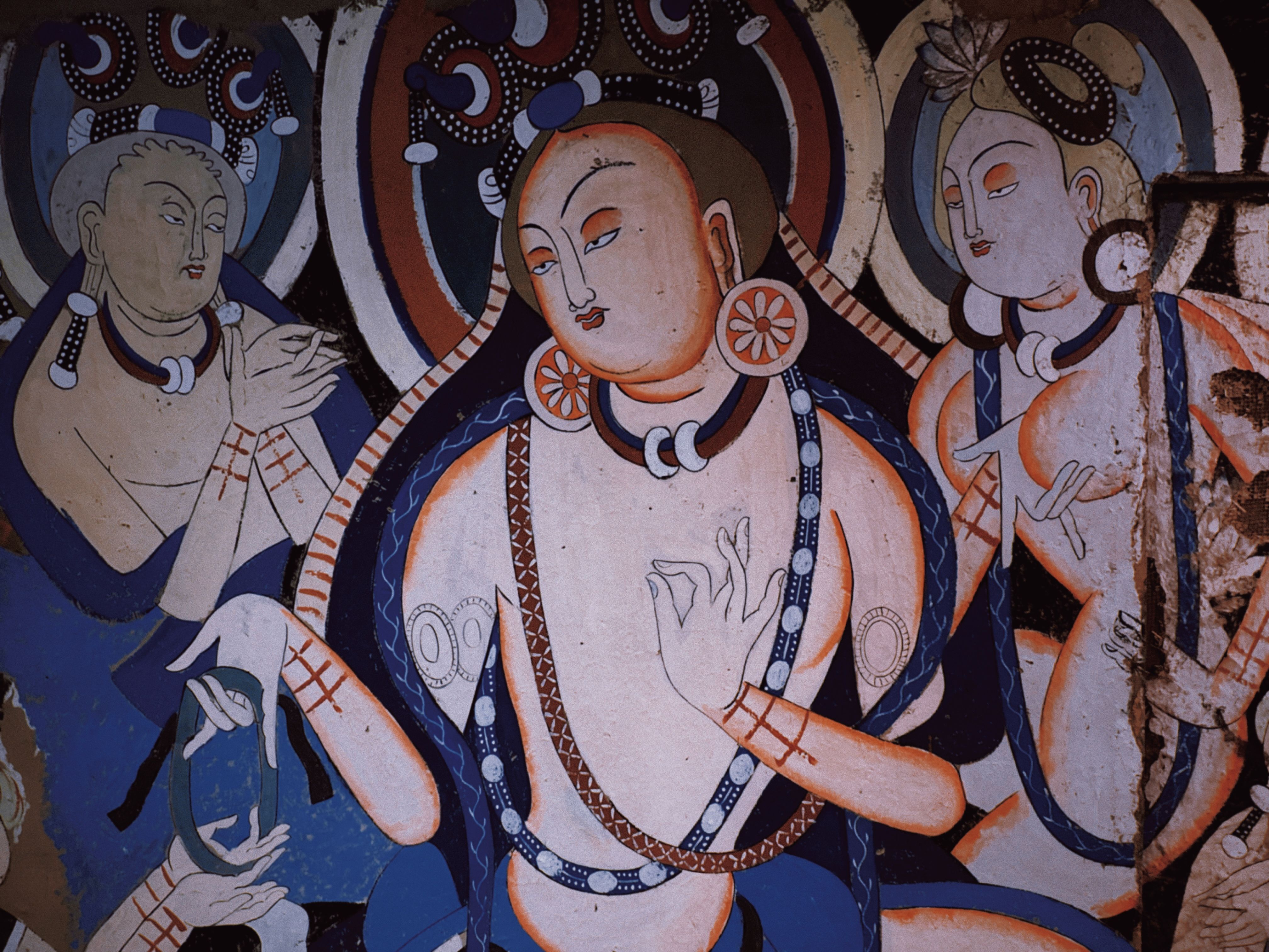 Detailed fresco of Buddhist figures with vibrant colors reflecting spiritual themes and historical significance.