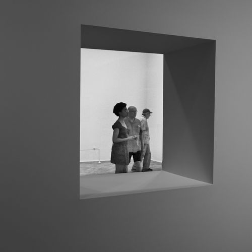 Free Visitors view art through a geometric aperture at a Chicago museum. Stock Photo