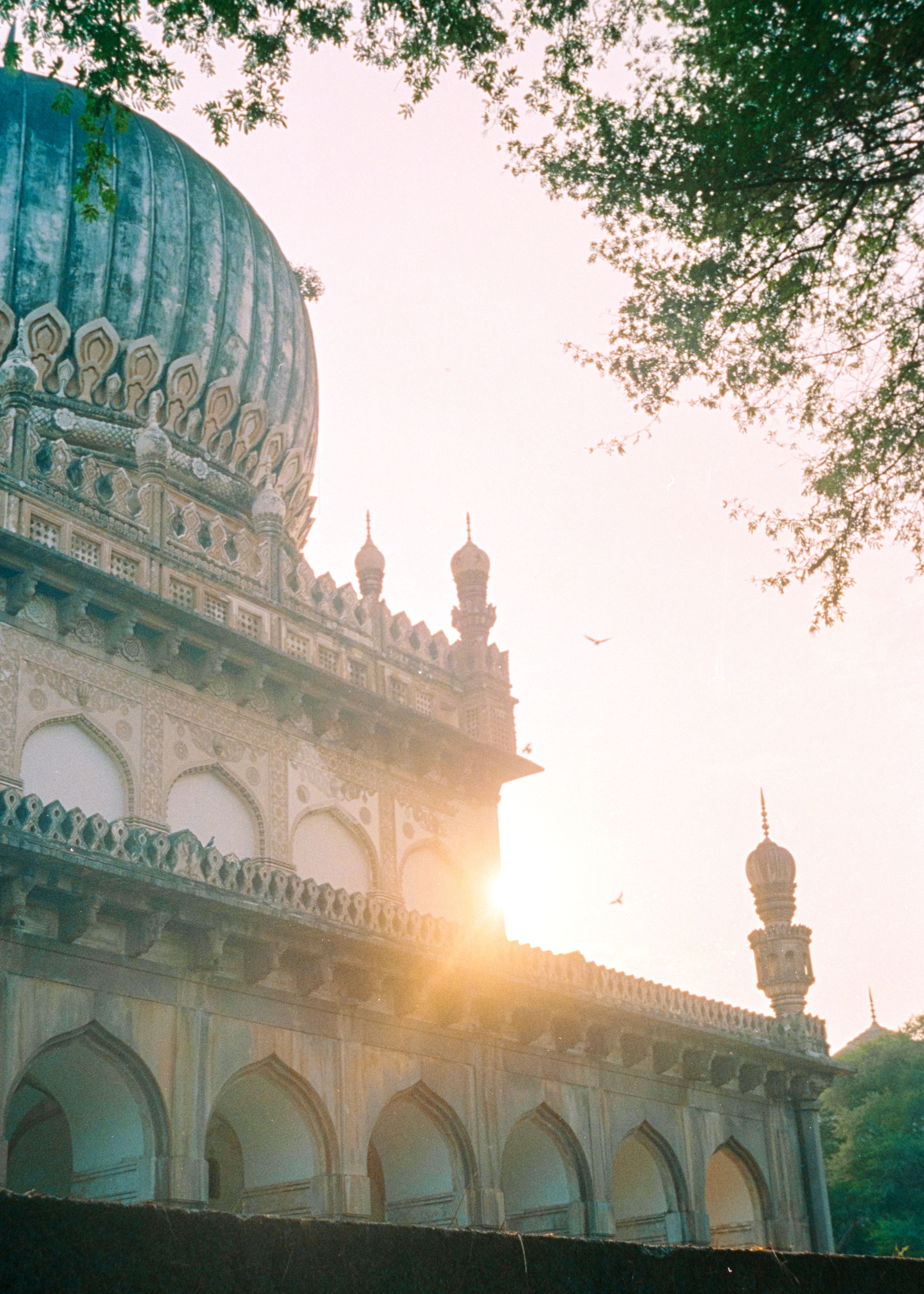 Beautiful view of Golkonda Fort in Hyderabad, bathed in warm sunset light.