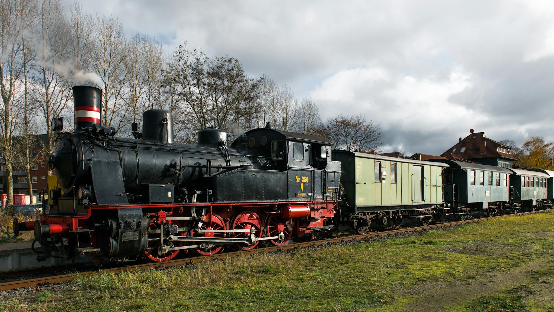 Historic steam train at Geesthacht, Germany showcasing railway nostalgia.