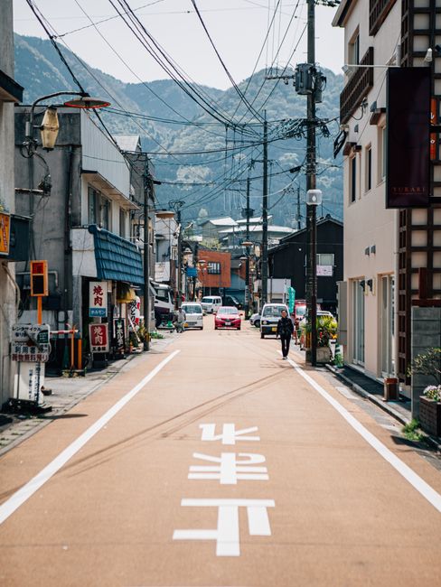 Traditional street view in Nagawa, Japan featuring charming buildings and scenic mountains.