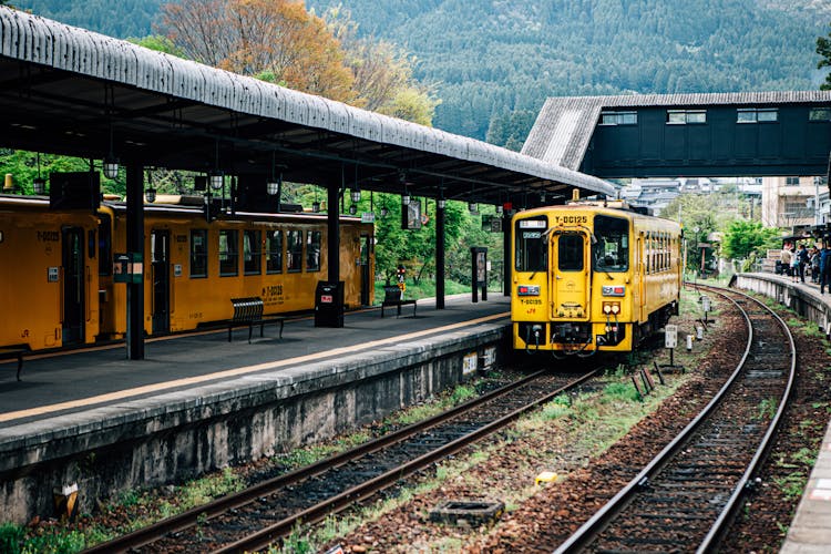 Bright Aged Train Arriving At Railway Station