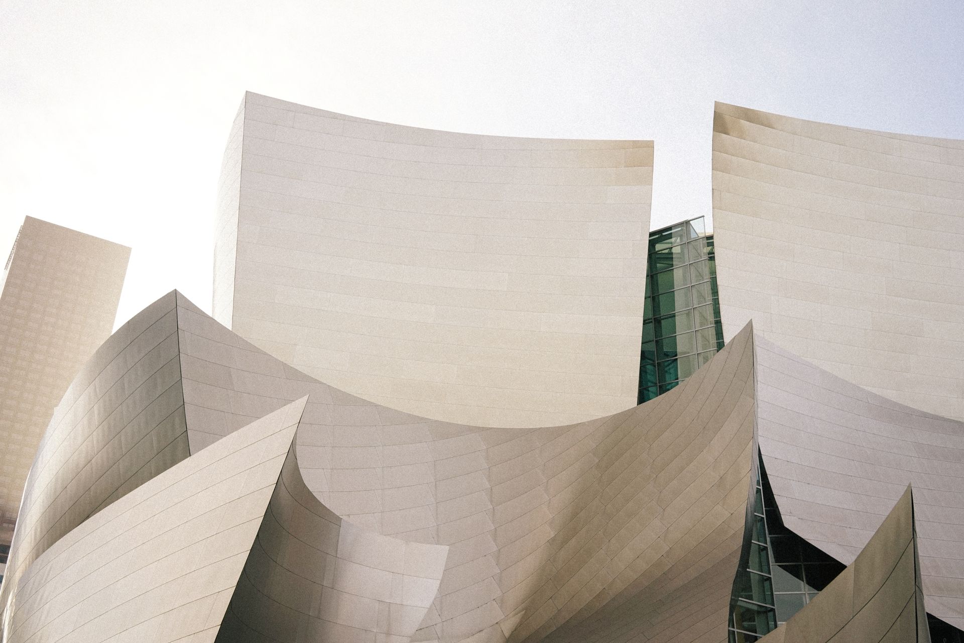 A close-up of the Walt Disney Concert Hall's unique modern architectural design in sunlight.