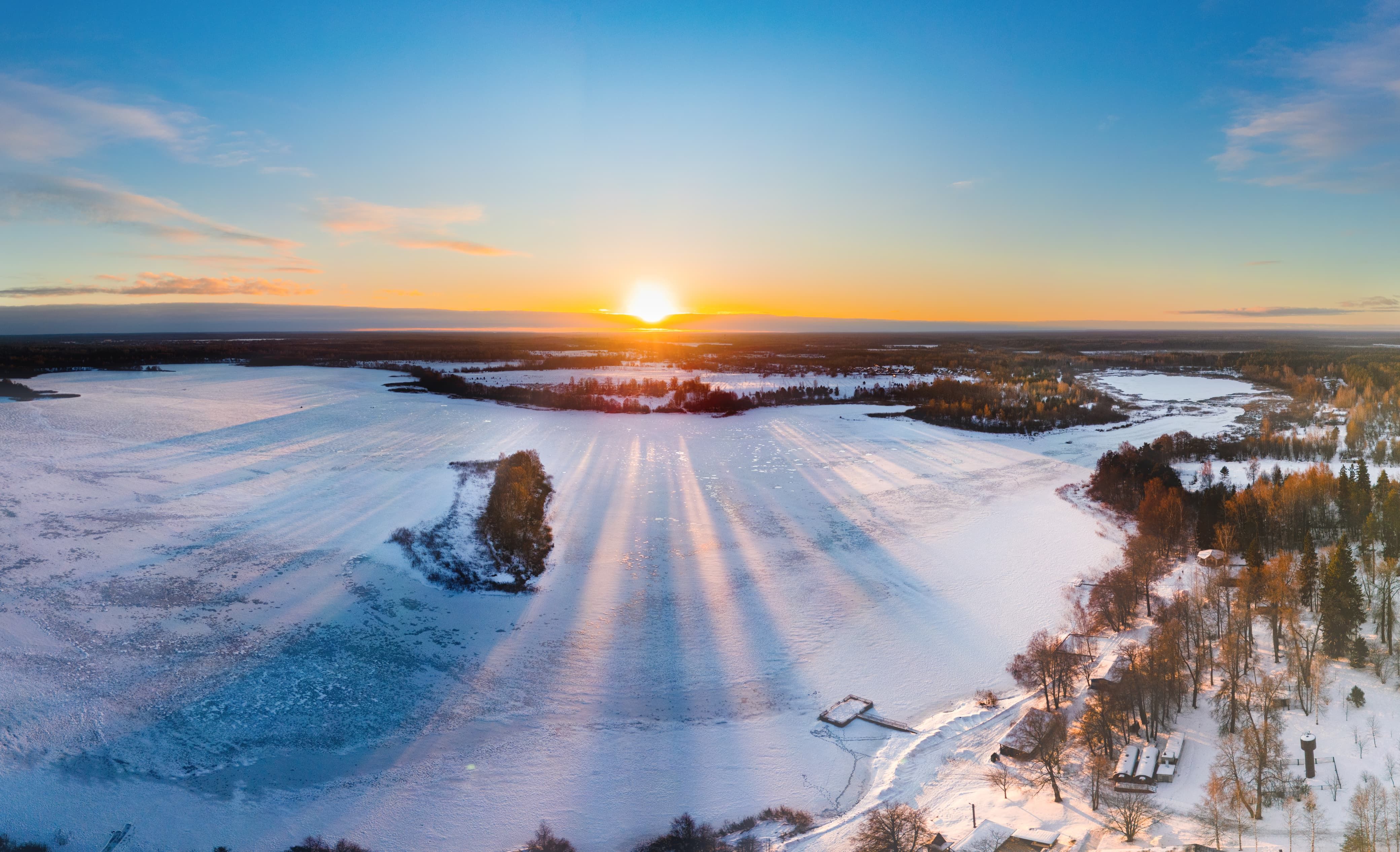 Stunning Winter Sunrise Over Frozen Lake · Free Stock Photo