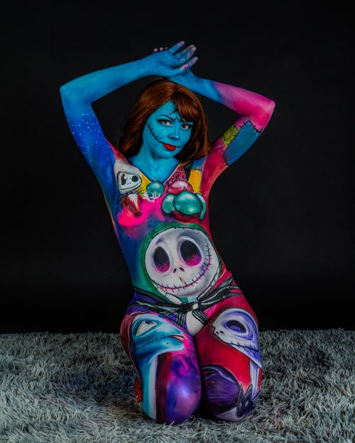 Free Colorful surreal body art on a model featuring fantasy and horror elements. Stock Photo