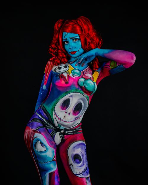 Free Colorful surreal body paint on woman, blending fantasy and surrealism in striking makeup. Stock Photo