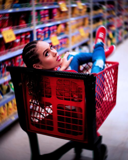 Woman In Red Grocery Cart