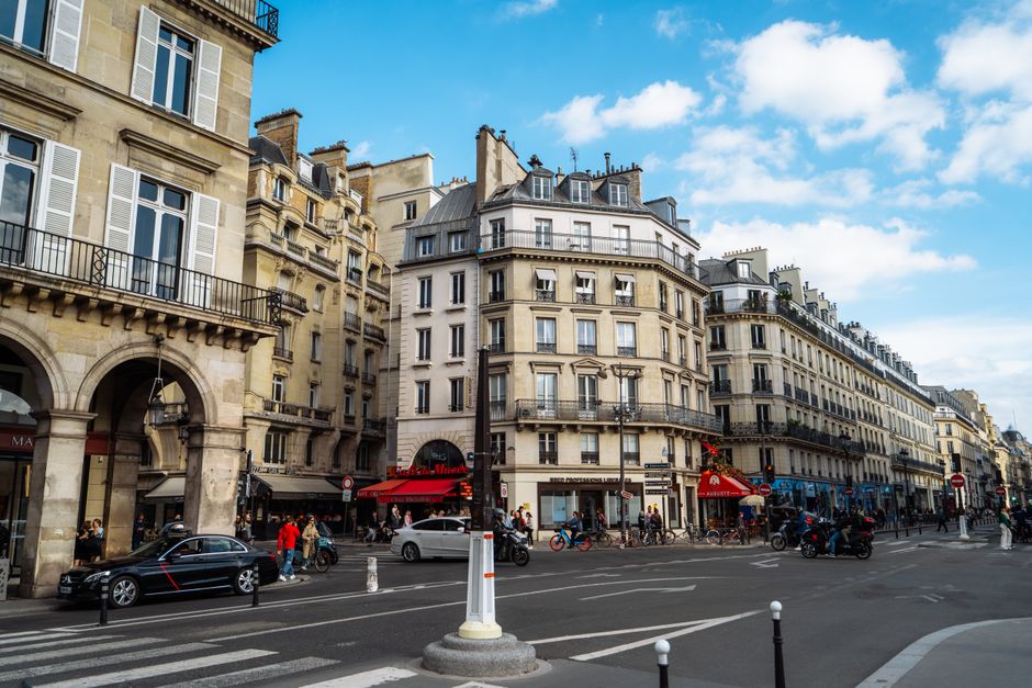 A lively street scene in Paris's Latin Quarter with cafes and historic buildings