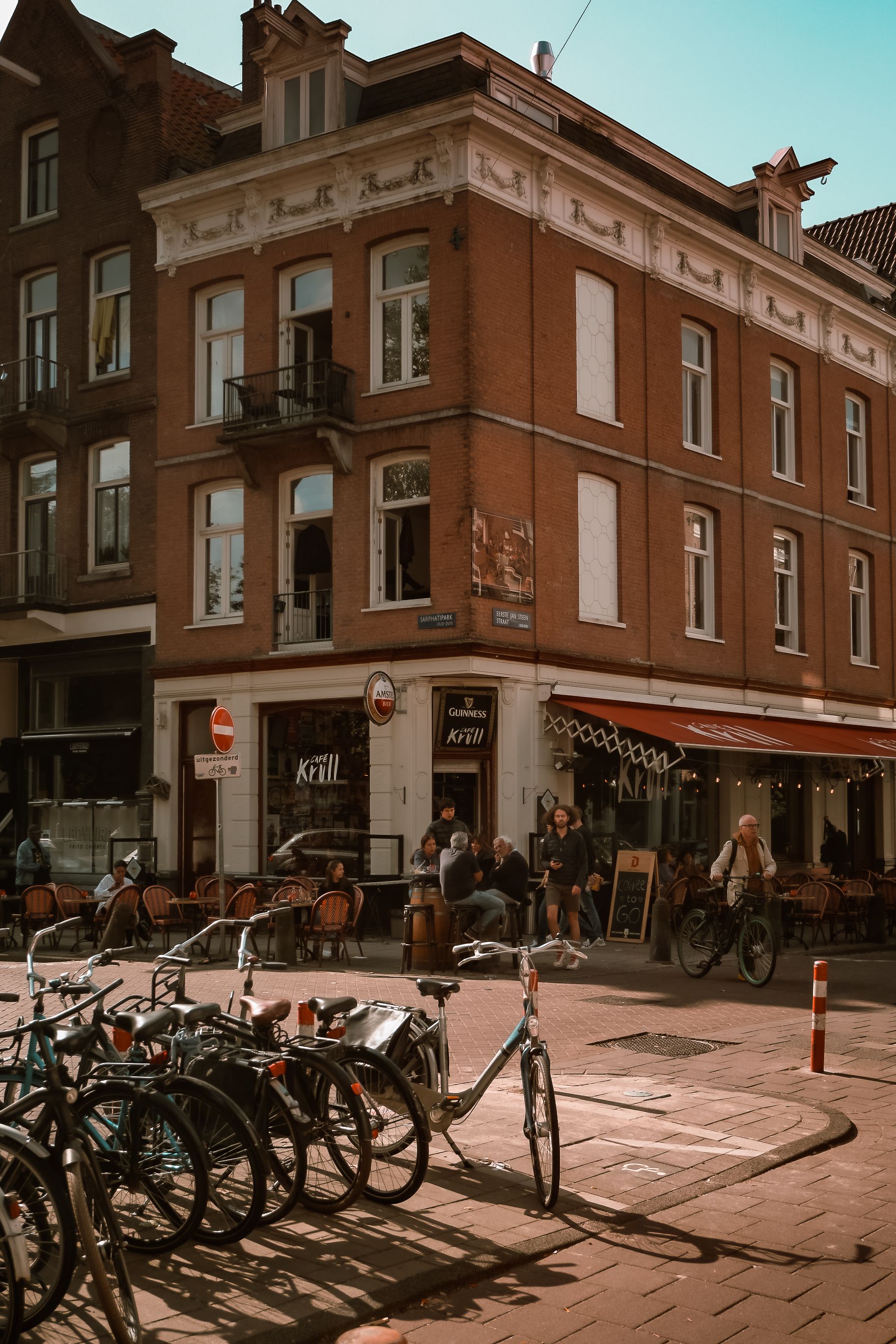 Amsterdam Street Scene with Bicycles and Café · Free Stock Photo