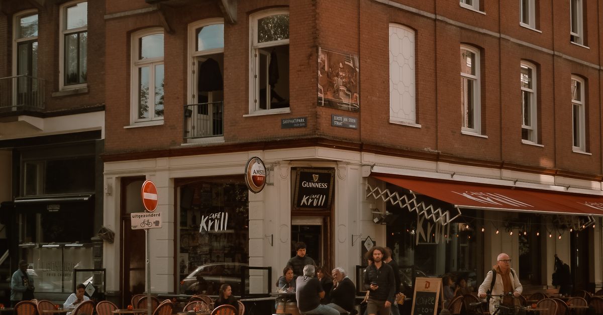 Amsterdam Street Scene with Bicycles and Café · Free Stock Photo