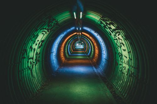 Free Explore a colorful, vibrant tunnel in Rennes, France, with dynamic lighting and a mysterious atmosphere. Stock Photo