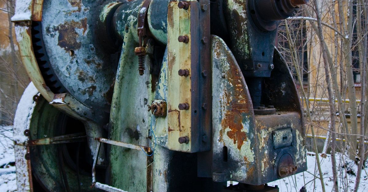 Abandoned Rusty Industrial Machine Outdoors · Free Stock Photo