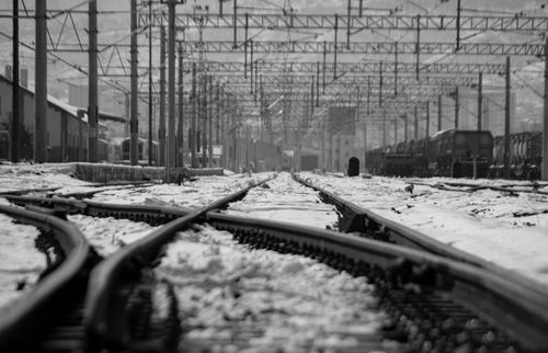 Free A winter scene of snow-covered railway tracks in Kayseri, Türkiye, capturing the essence of train travel. Stock Photo