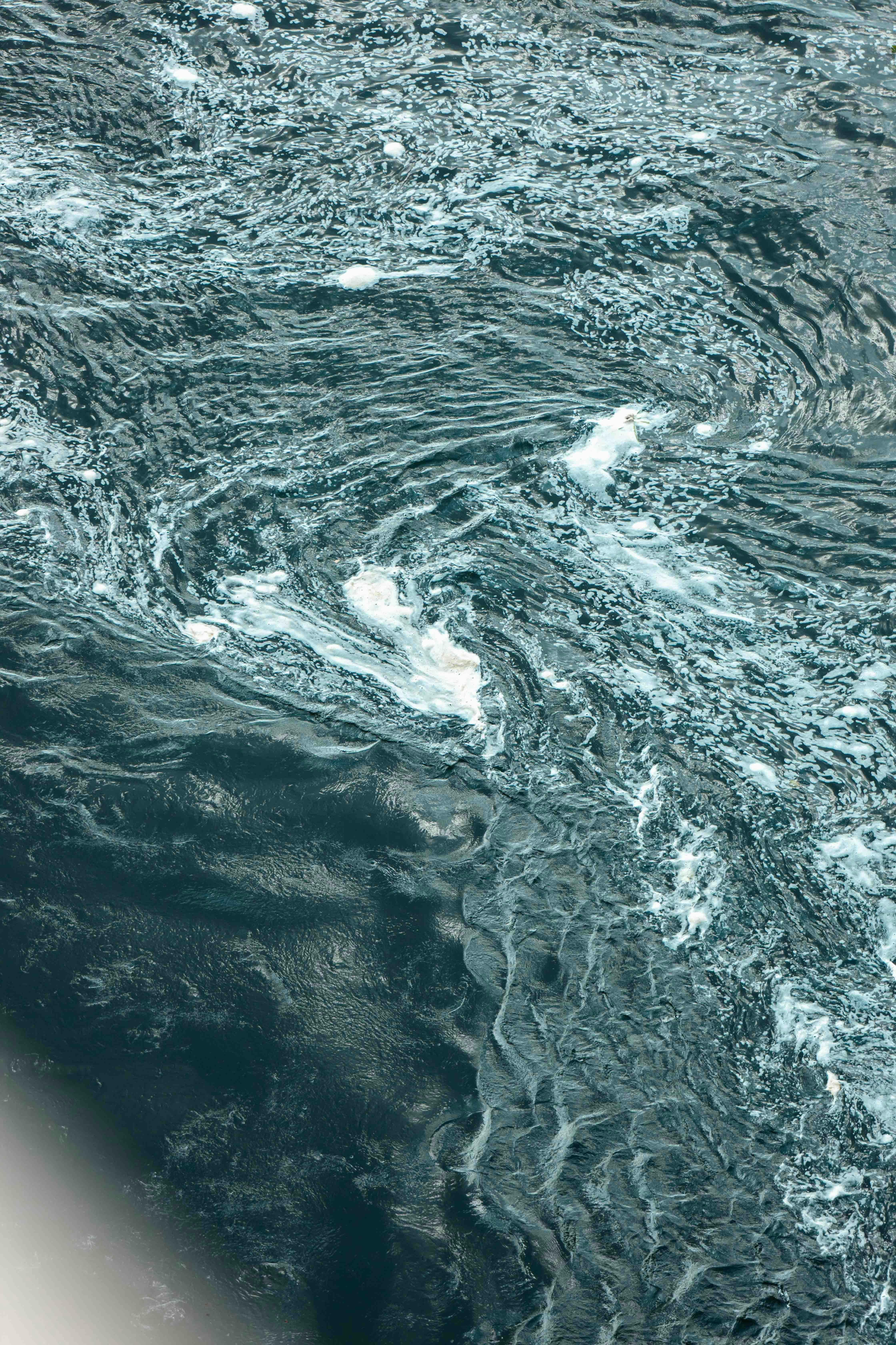 Aerial view of swirling ocean currents · Free Stock Photo