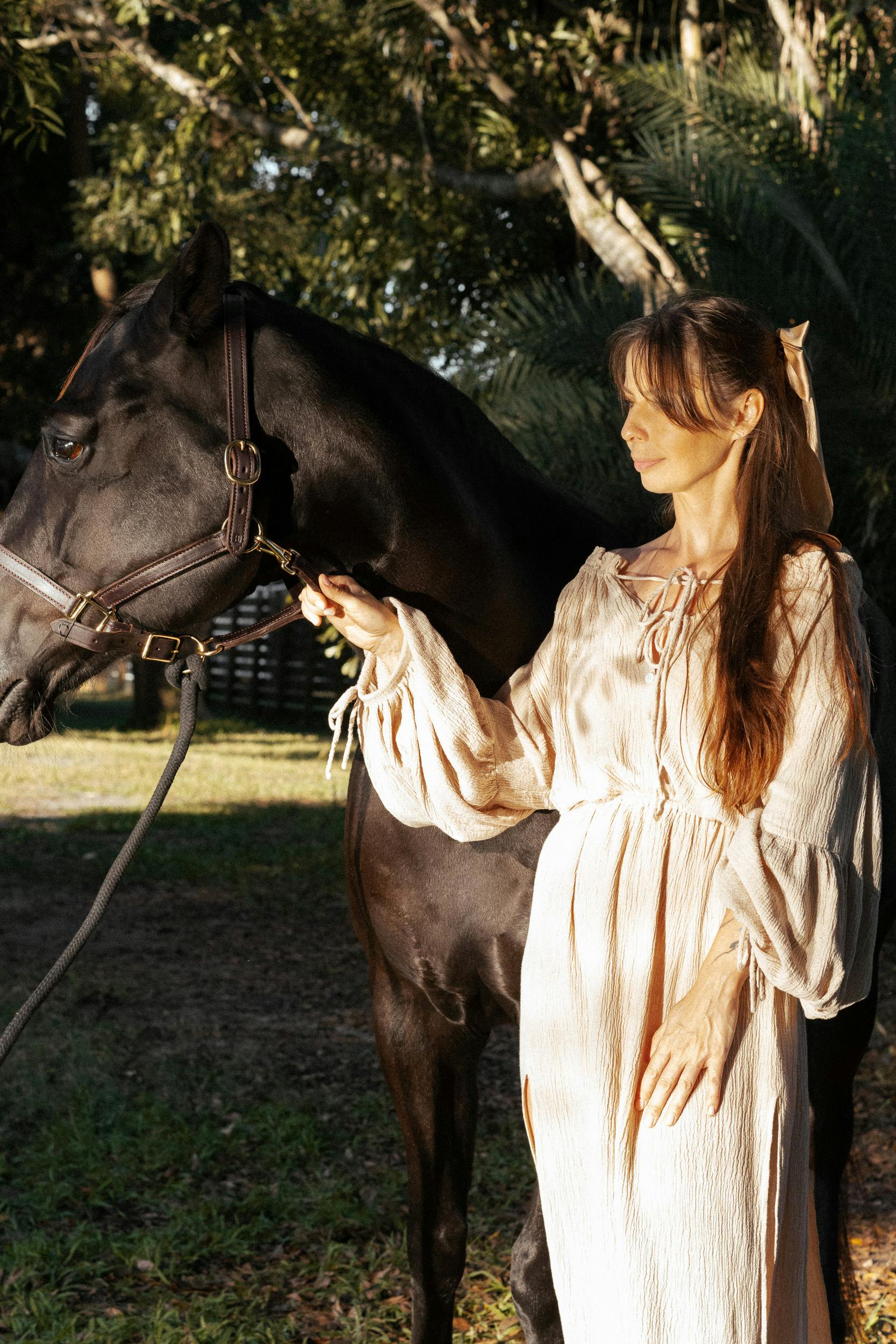 Young Woman in Dress Sitting on a Palomino Horse · Free