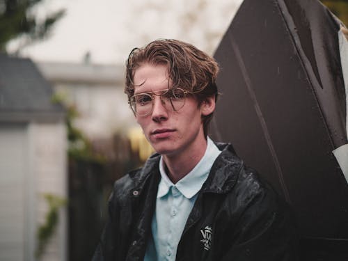 Selective Focus Photography Of Man Wearing Black Jacket