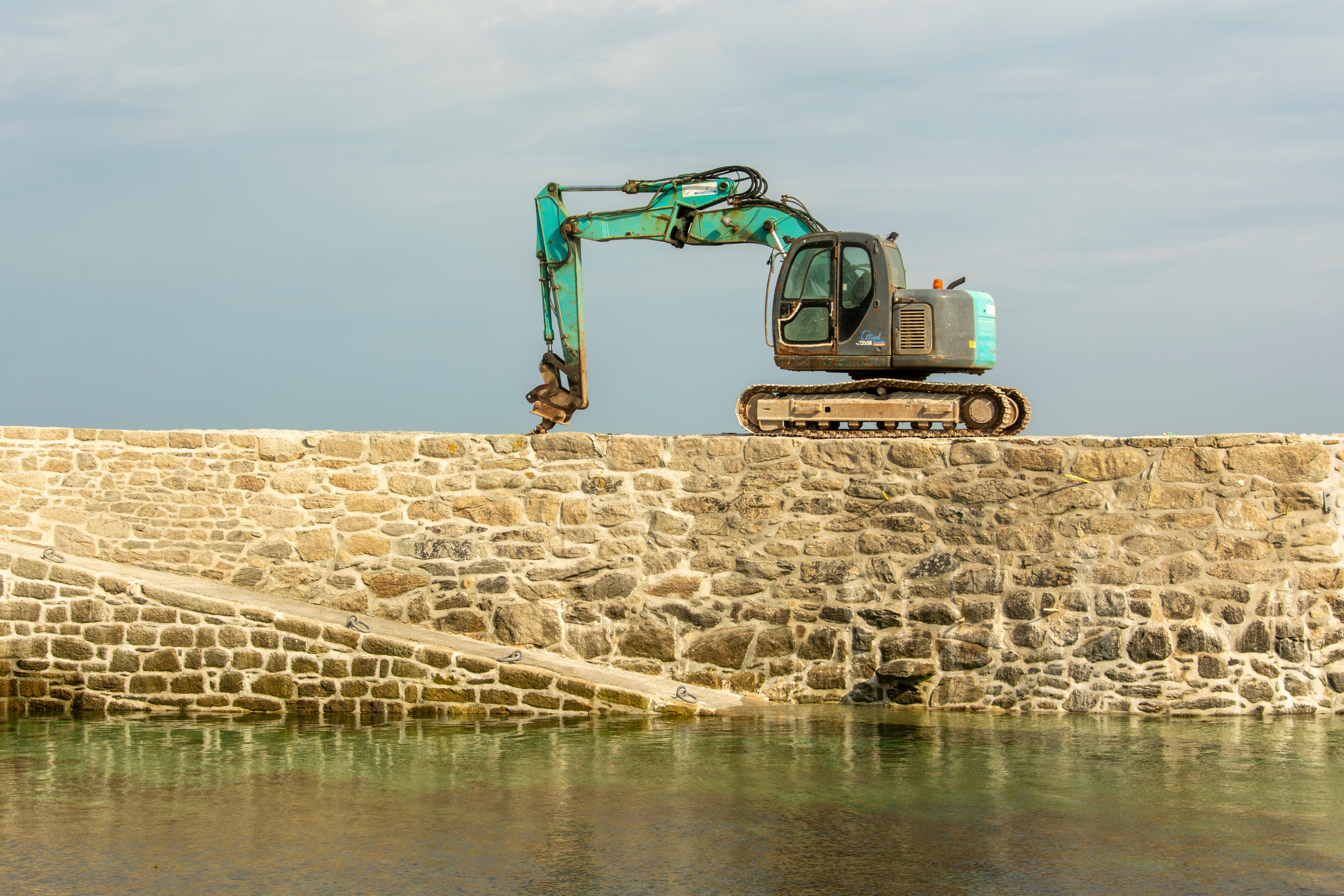 Hydraulic pier installation equipment stabilizing a residential foundation in Topeka Kansas during repair work