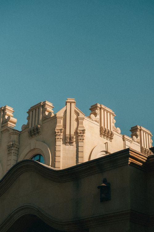Free Aged architectural details under a clear blue sky in Baku, showcasing historic elegance. Stock Photo