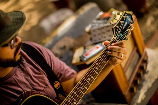 A musician playing an acoustic guitar outdoors, creating a relaxed atmosphere in San Juan.