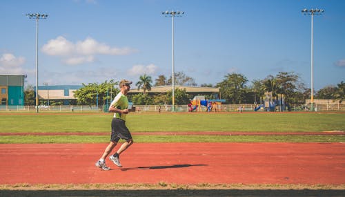 Man Running On A Field