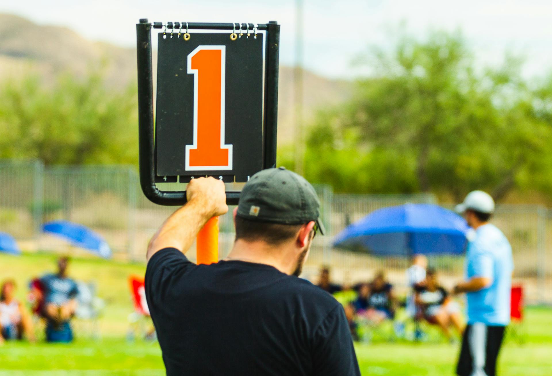 Unrecognizable man near scoreboard during sports competition