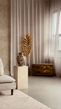 Elegant wabi sabi styled room with neutral decor featuring a metal vase and tall curtains in soft lighting.. pexels, elegant,