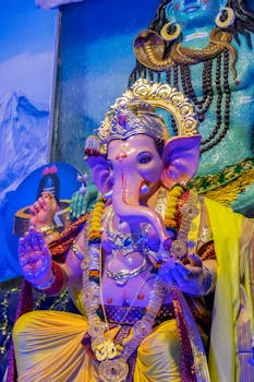 Colorful Ganesh idol during festival in Mumbai, showcasing Hindu traditions and culture.
