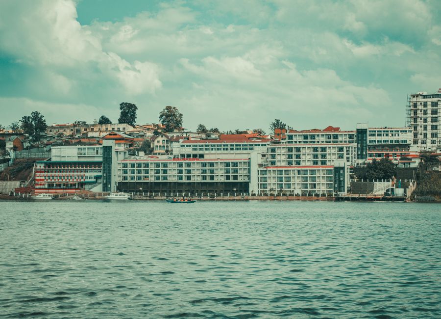 Tranquil view of the Bukavu waterfront with modern architecture and lake in Sud-Kivu, DRC.