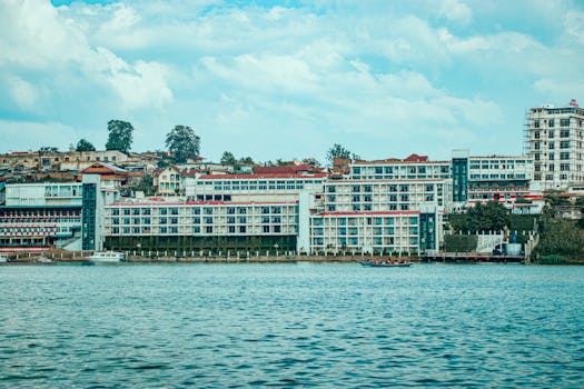 Colorful lakeside architecture in Bukavu, DRC, with a vibrant skyline and vibrant waterscape.